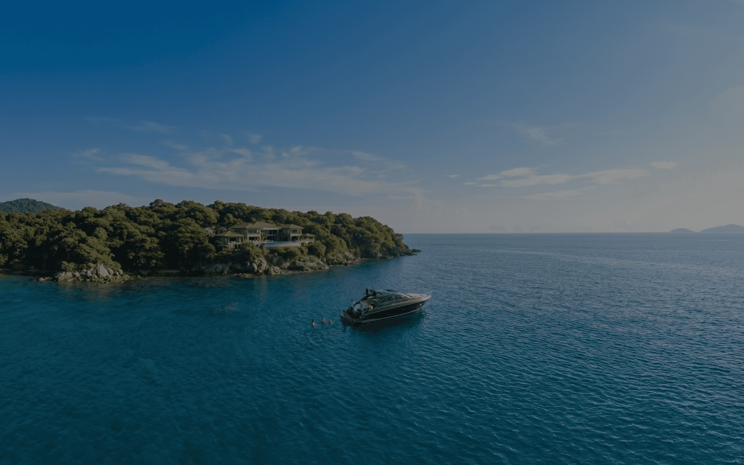 Luxury boat docked near a serene coastline.